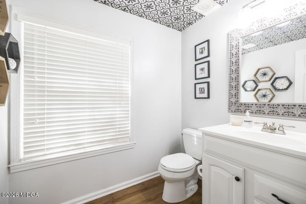 4759 Oxford Road Macon, GA 31210 - Photo 20 of 42 a bathroom with a toilet sink and mirror