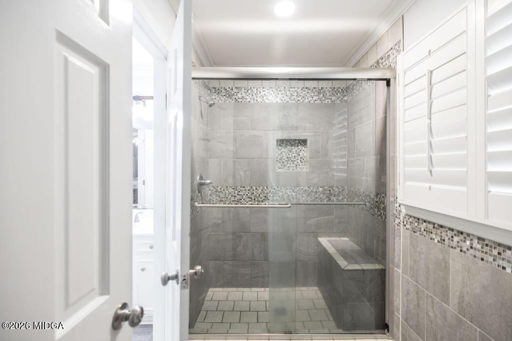 4759 Oxford Road Macon, GA 31210 - Photo 25 of 42 a bathroom with a glass shower door