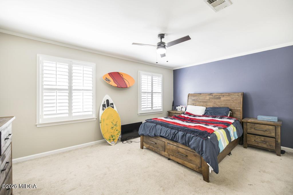 4759 Oxford Road Macon, GA 31210 - Photo 33 of 42 a spacious bedroom with a bed and a window