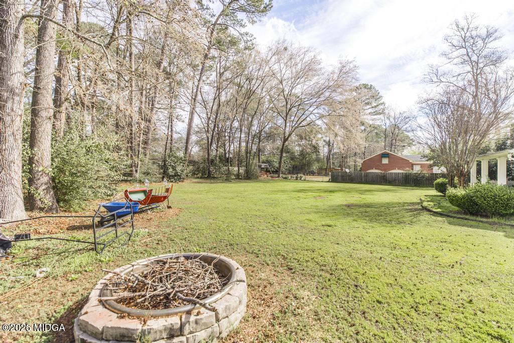 4759 Oxford Road Macon, GA 31210 - Photo 42 of 42 a view of a backyard with a garden and entertaining space