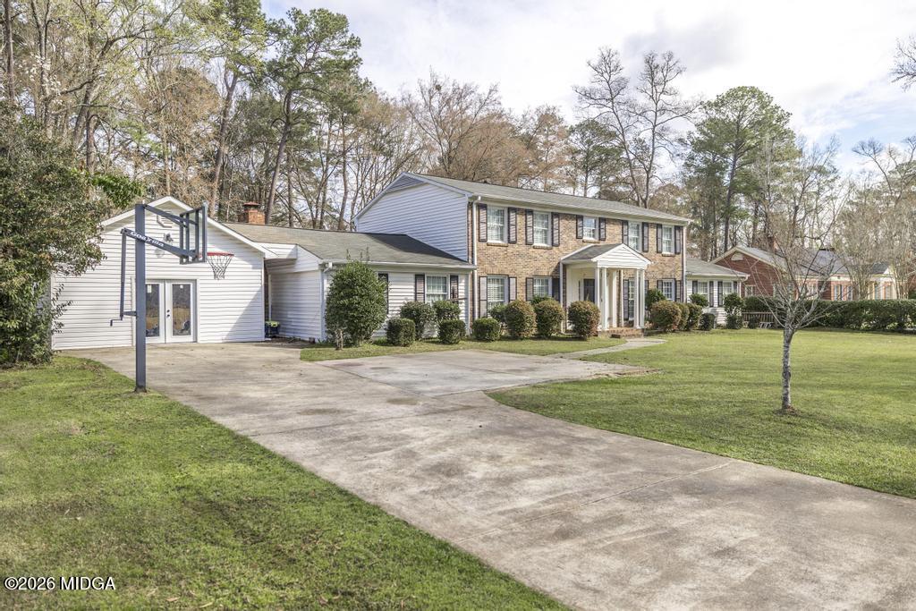 4759 Oxford Road Macon, GA 31210 - Photo 5 of 42 a front view of a house with a yard