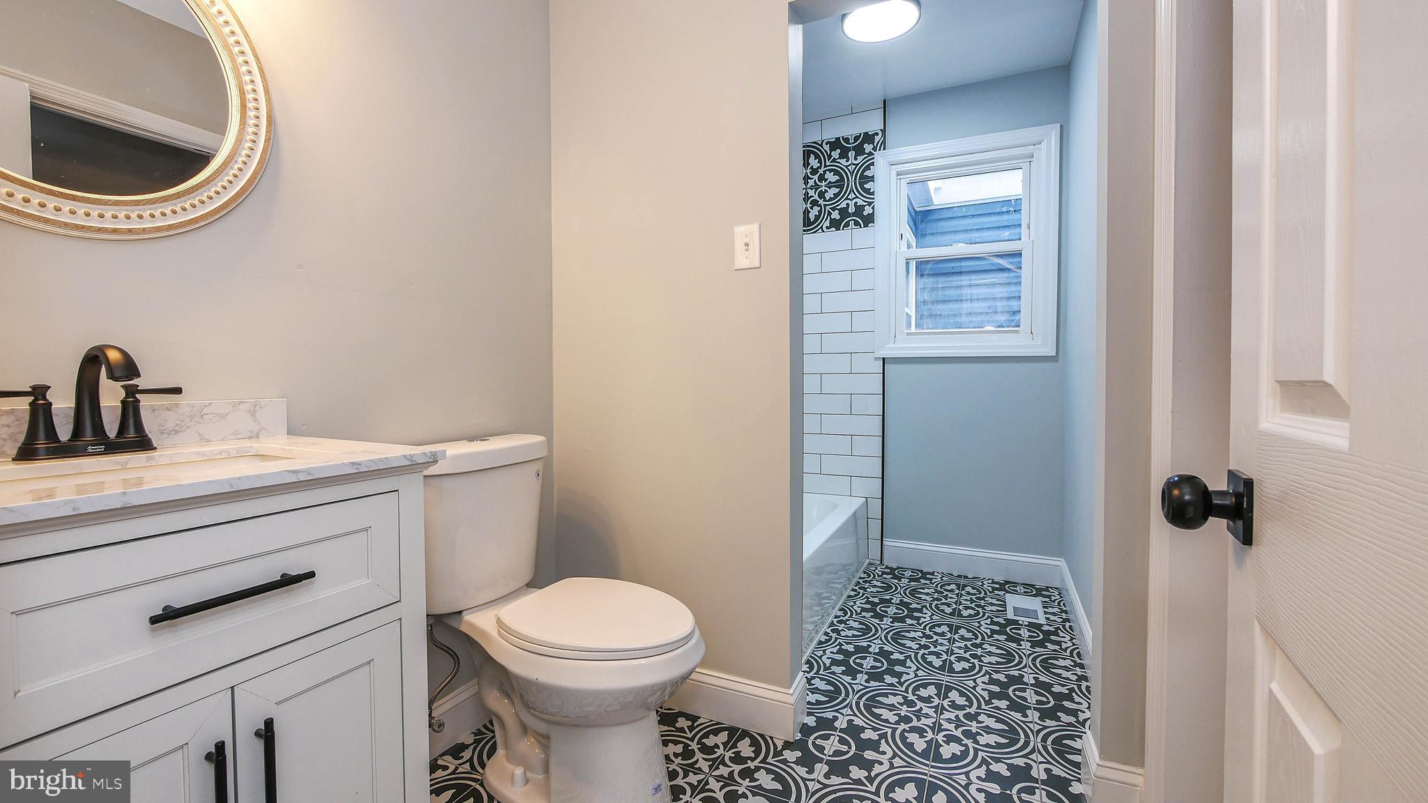 4623 Schooner Road, Unit A Brigantine, NJ 08203 - Photo 16 of 30 a bathroom with a sink a toilet and a shower