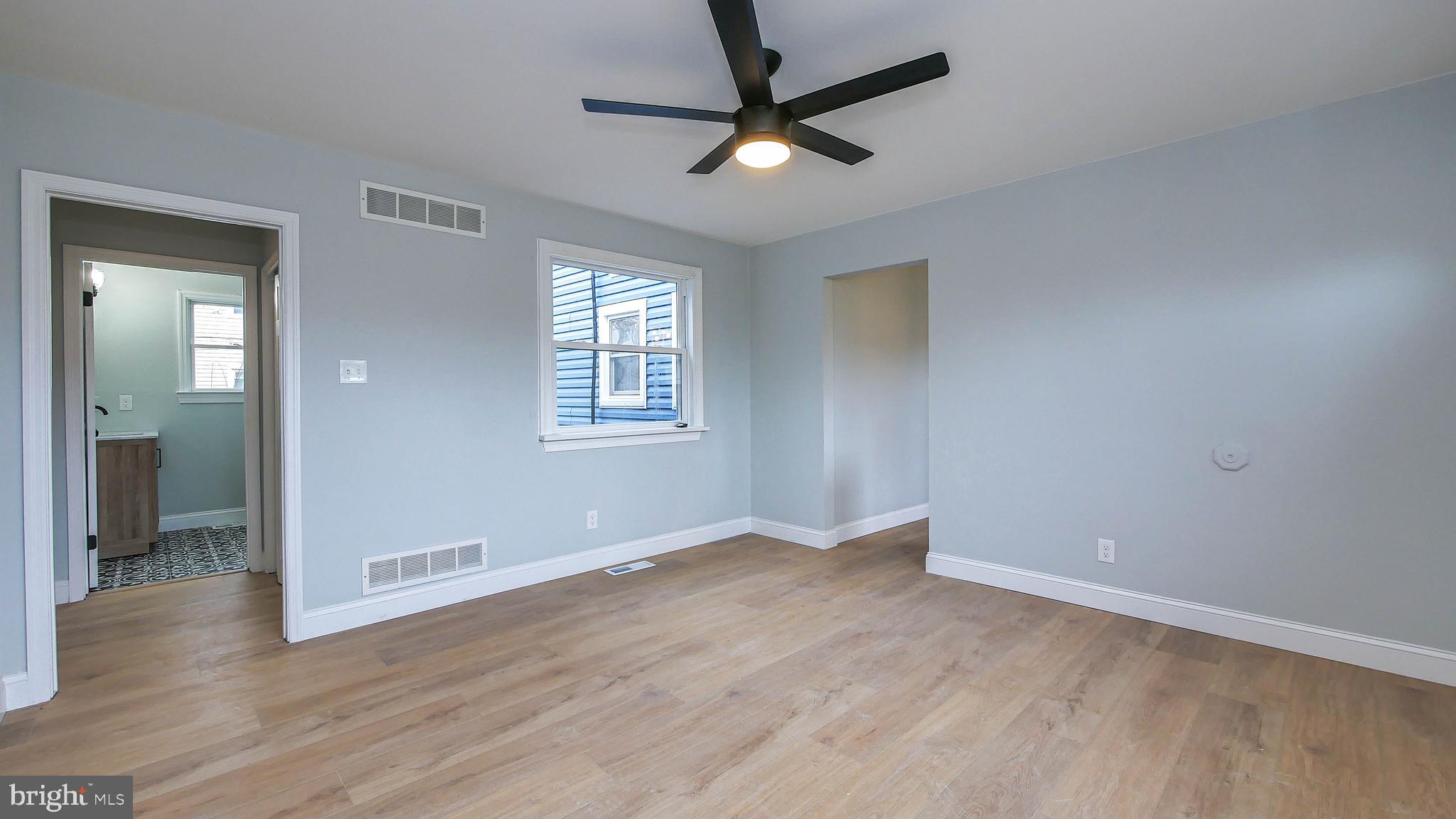4623 Schooner Road, Unit A Brigantine, NJ 08203 - Photo 24 of 30 wooden floor in an empty room with a window