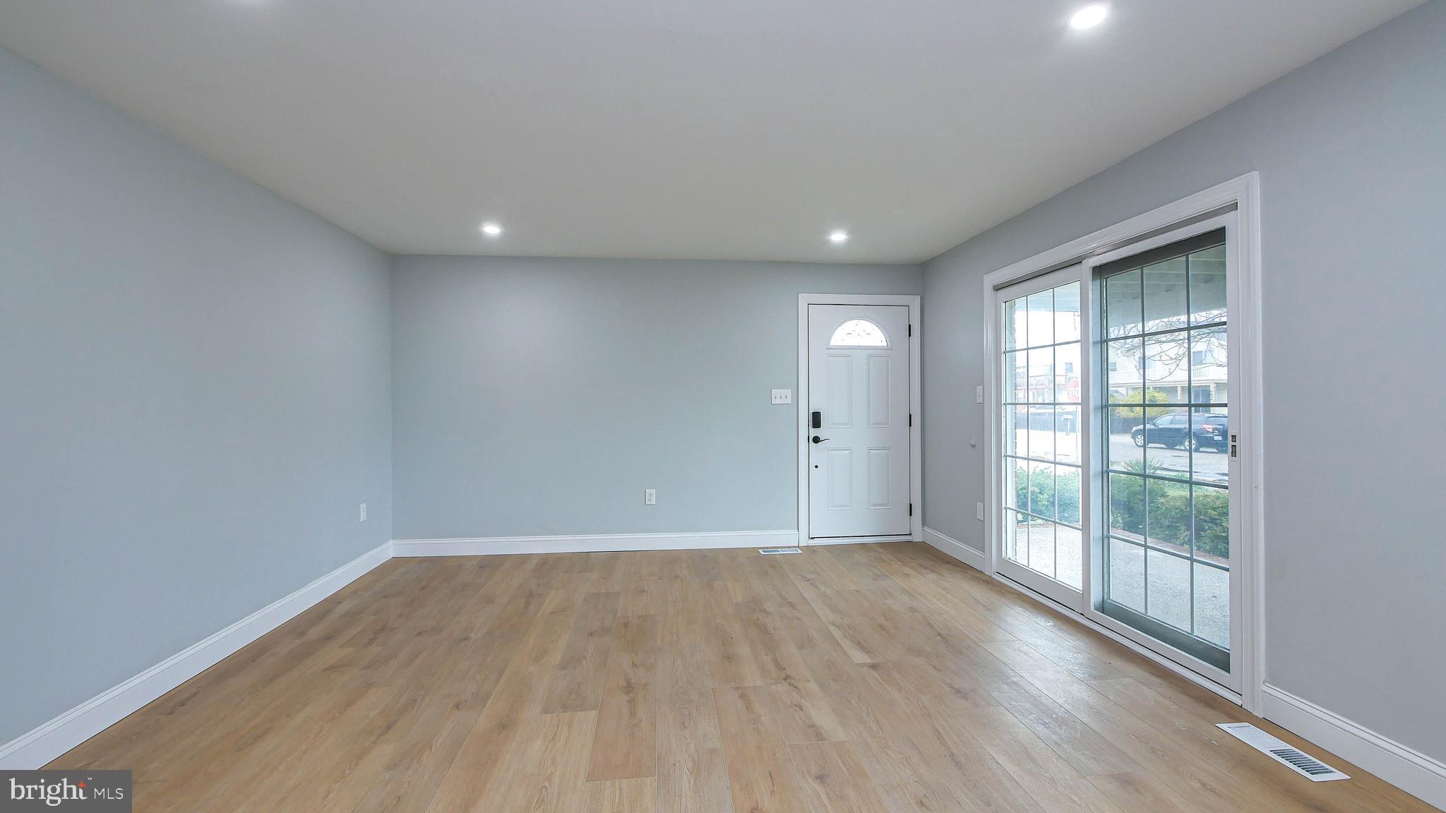 4623 Schooner Road, Unit A Brigantine, NJ 08203 - Photo 7 of 30 wooden floor in an empty room with a window