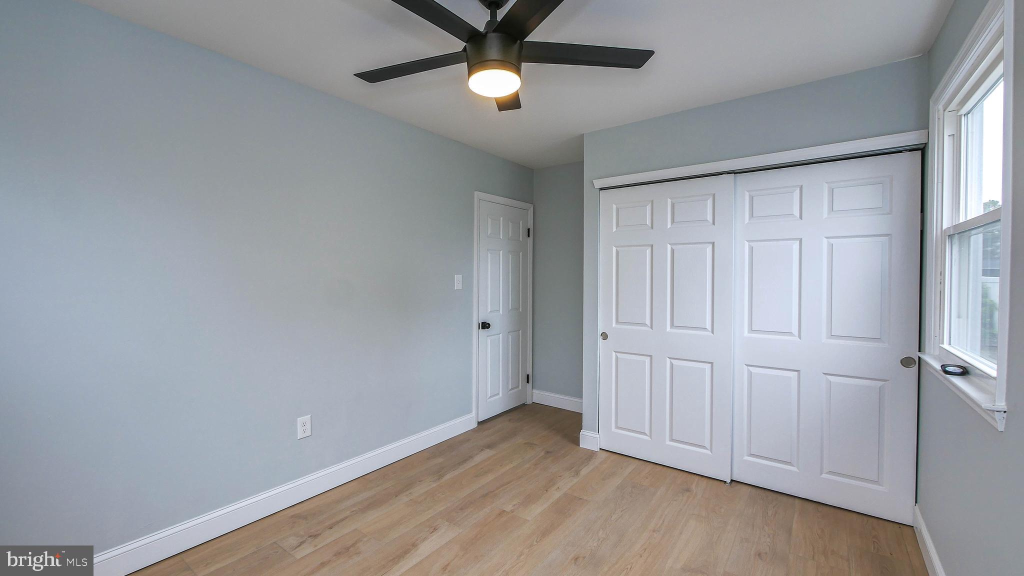 4623 Schooner Road, Unit A Brigantine, NJ 08203 - Photo 9 of 30 wooden floor in an empty room with a window
