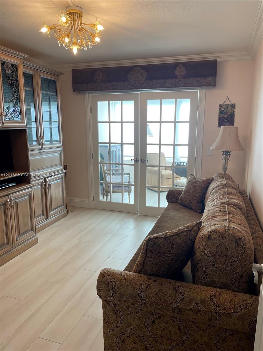 2091 Yarmouth East, Unit 2091 Boca Raton, FL 33434 - Photo 6 of 15 a living room with furniture and a flat screen tv
