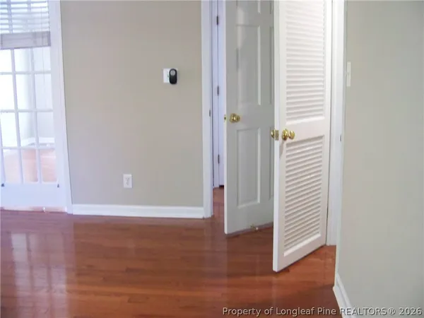 a view of a bathroom with wooden floor