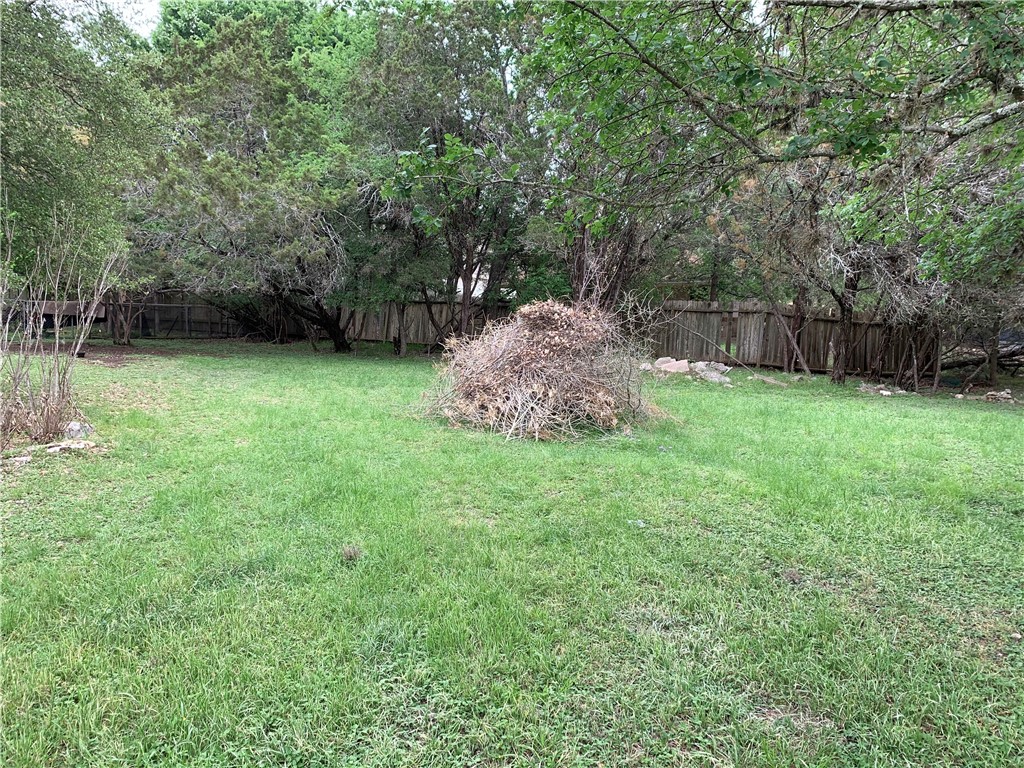 27 Fallbrook Circle Wimberley, TX 78676 - Photo 1 of 1 a view of a backyard with a trees