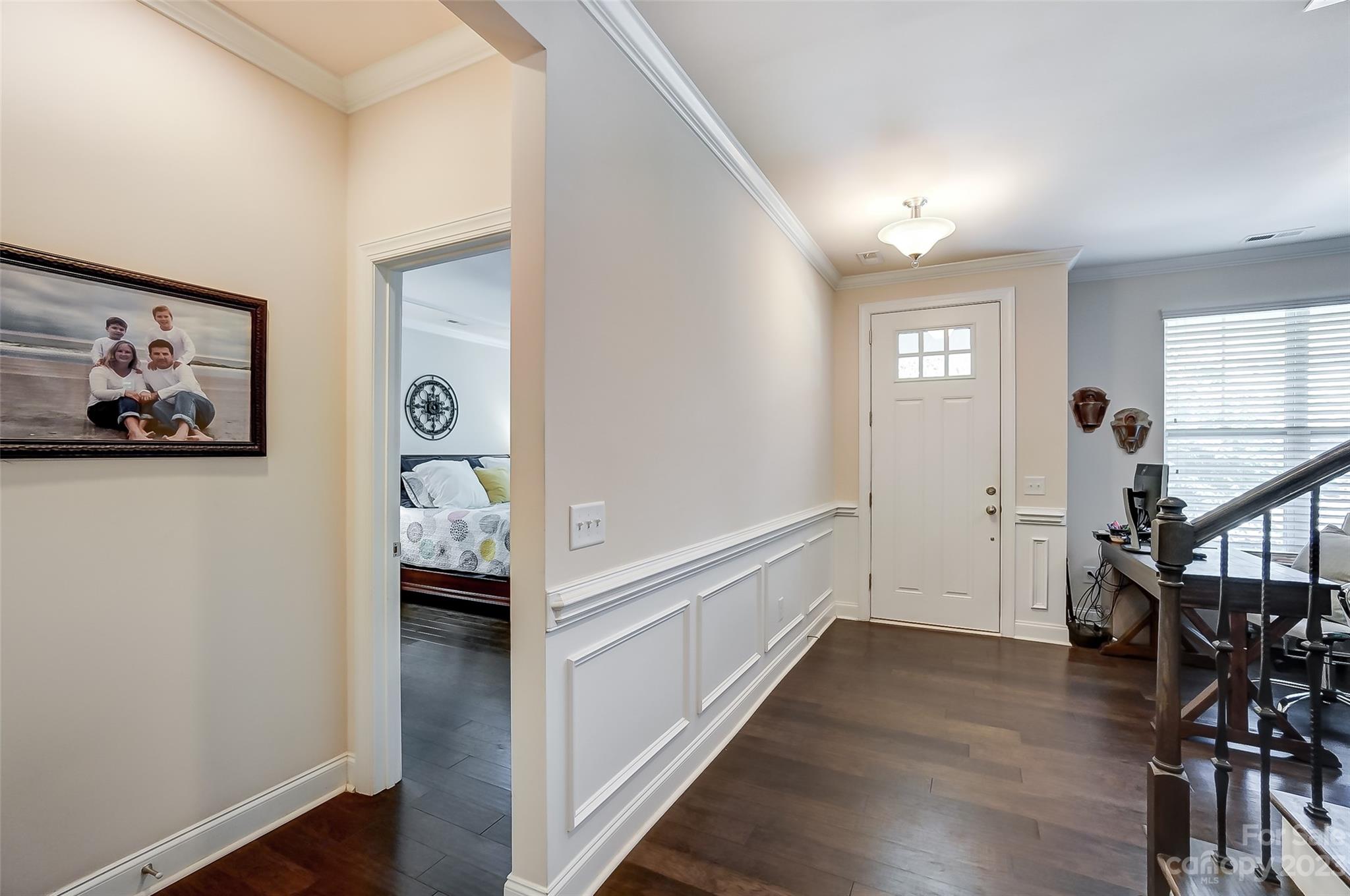 116 Helton Lane Fort Mill, SC 29708 - Photo 4 of 41 a view of hallway with wooden floor and stairs