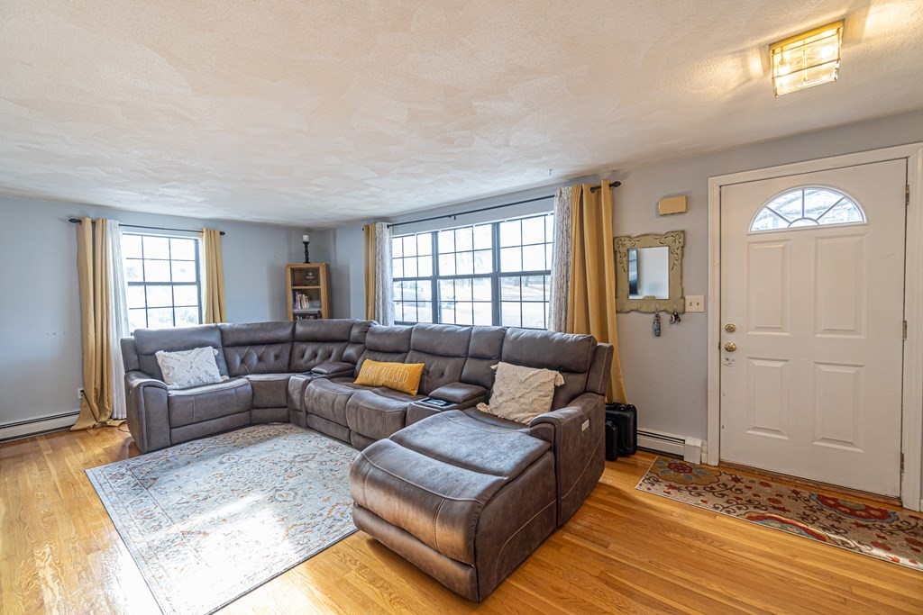 74-76 George Road Winchester, MA 01890 - Photo 24 of 42 a living room with furniture and a window