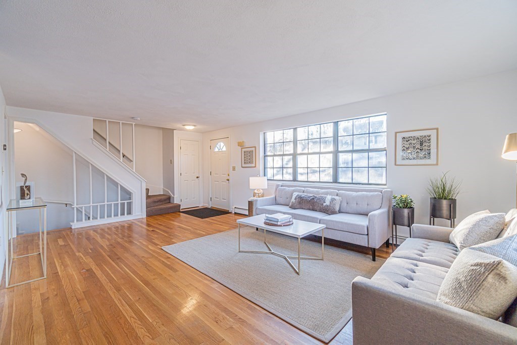74-76 George Road Winchester, MA 01890 - Photo 3 of 42 a living room with furniture and a large window