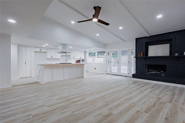 a view of an empty room with a fireplace