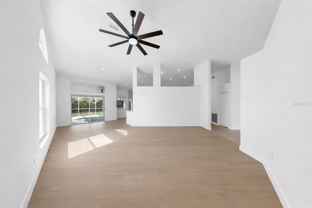 6409 Stone River Road Bradenton, FL 34203 - Photo 11 of 72 a view of a livingroom with a ceiling fan and window