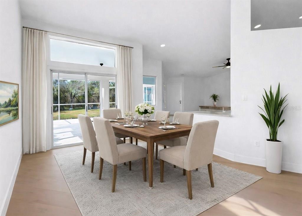 6409 Stone River Road Bradenton, FL 34203 - Photo 13 of 72 a view of a dining room with furniture window and outside view