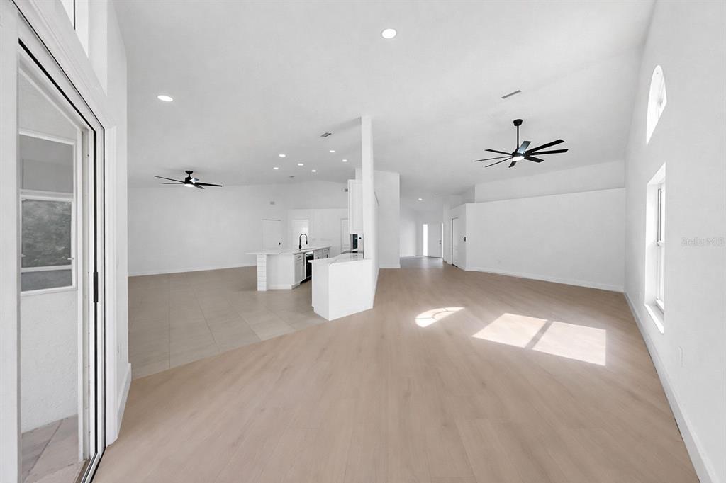 6409 Stone River Road Bradenton, FL 34203 - Photo 14 of 72 a view of a livingroom with a ceiling fan and window