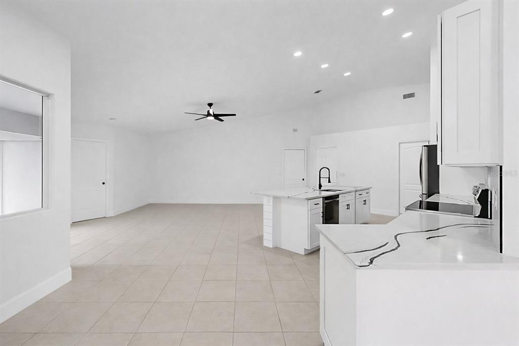 6409 Stone River Road Bradenton, FL 34203 - Photo 17 of 72 a kitchen with a sink and cabinets