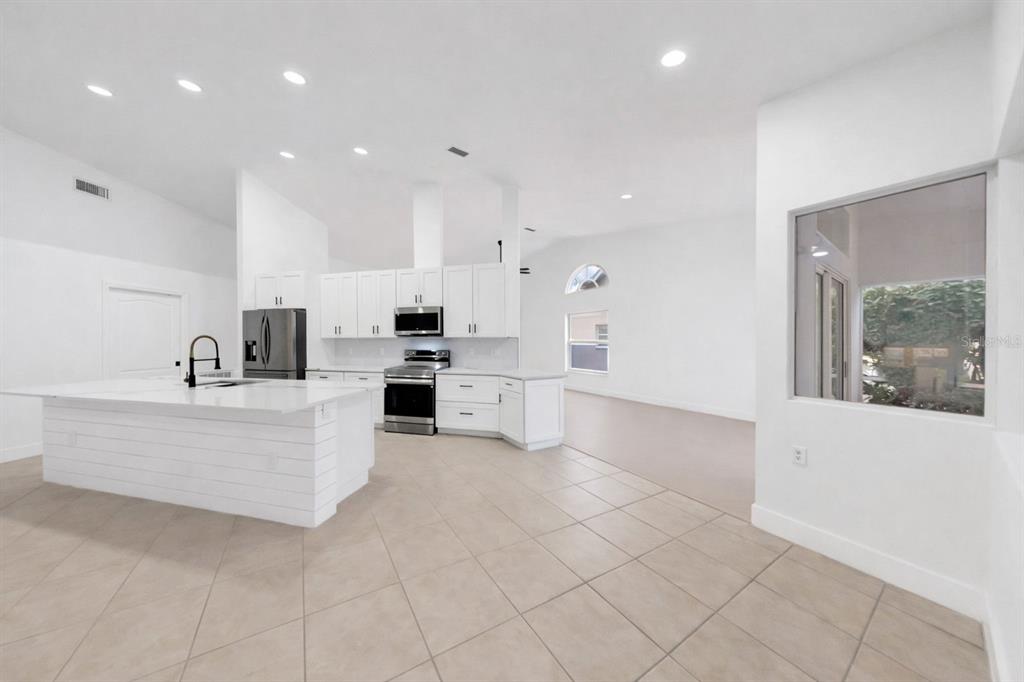 6409 Stone River Road Bradenton, FL 34203 - Photo 23 of 72 a view of kitchen with stainless steel appliances furniture a window and a kitchen view