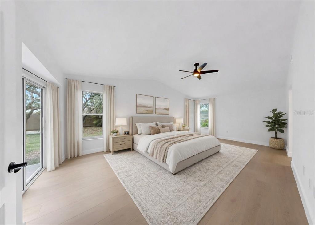 6409 Stone River Road Bradenton, FL 34203 - Photo 36 of 72 a bedroom with a large bed and a window