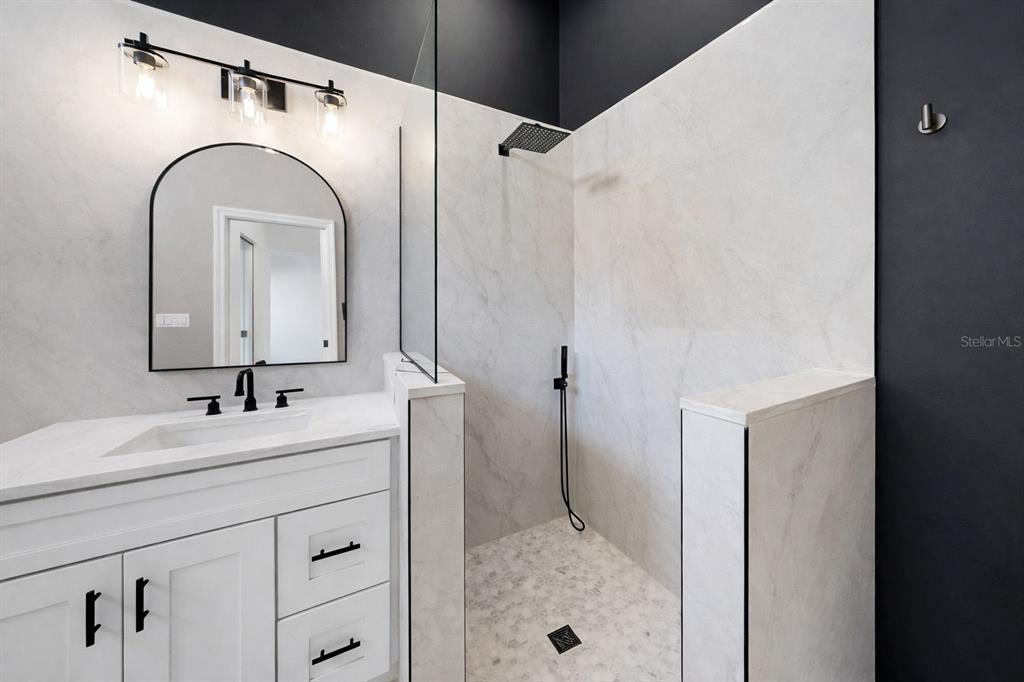 6409 Stone River Road Bradenton, FL 34203 - Photo 45 of 72 a bathroom with a sink and a mirror
