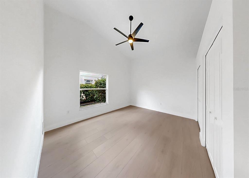 6409 Stone River Road Bradenton, FL 34203 - Photo 48 of 72 an empty room with windows and closet