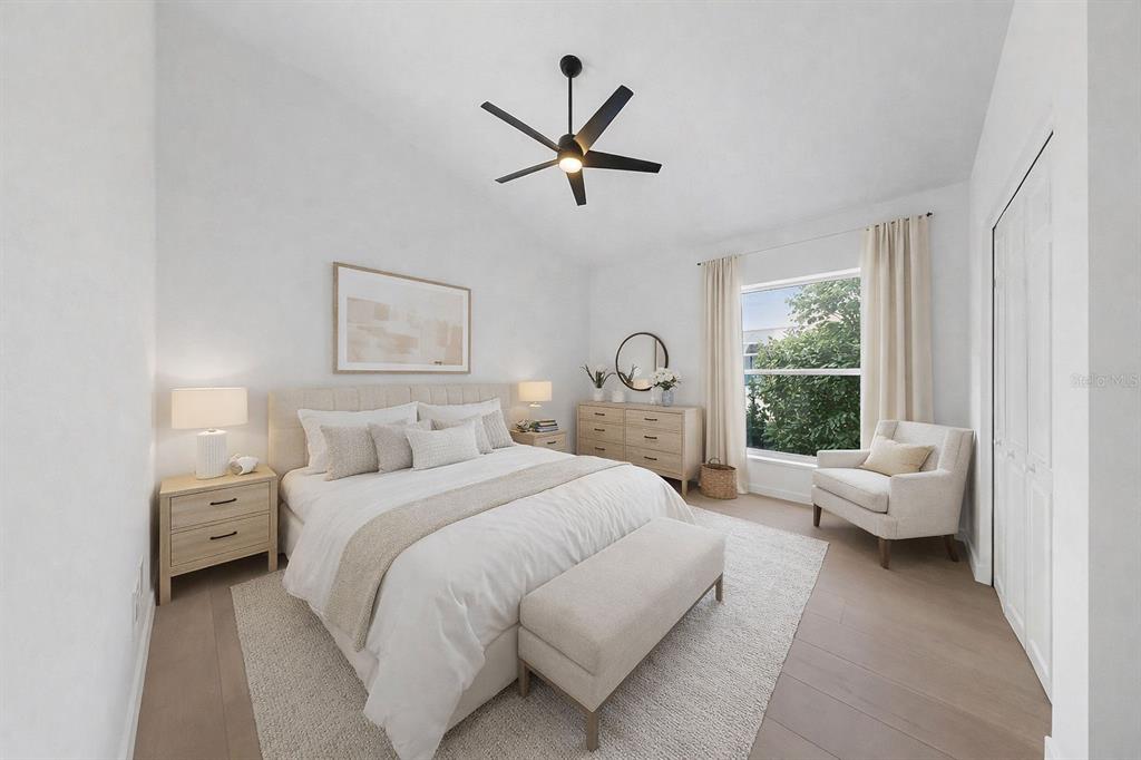 6409 Stone River Road Bradenton, FL 34203 - Photo 50 of 72 a bedroom with a bed and a large window