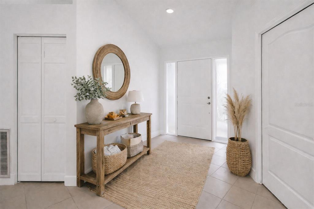 6409 Stone River Road Bradenton, FL 34203 - Photo 5 of 72 a bathroom with a sink a toilet and a mirror