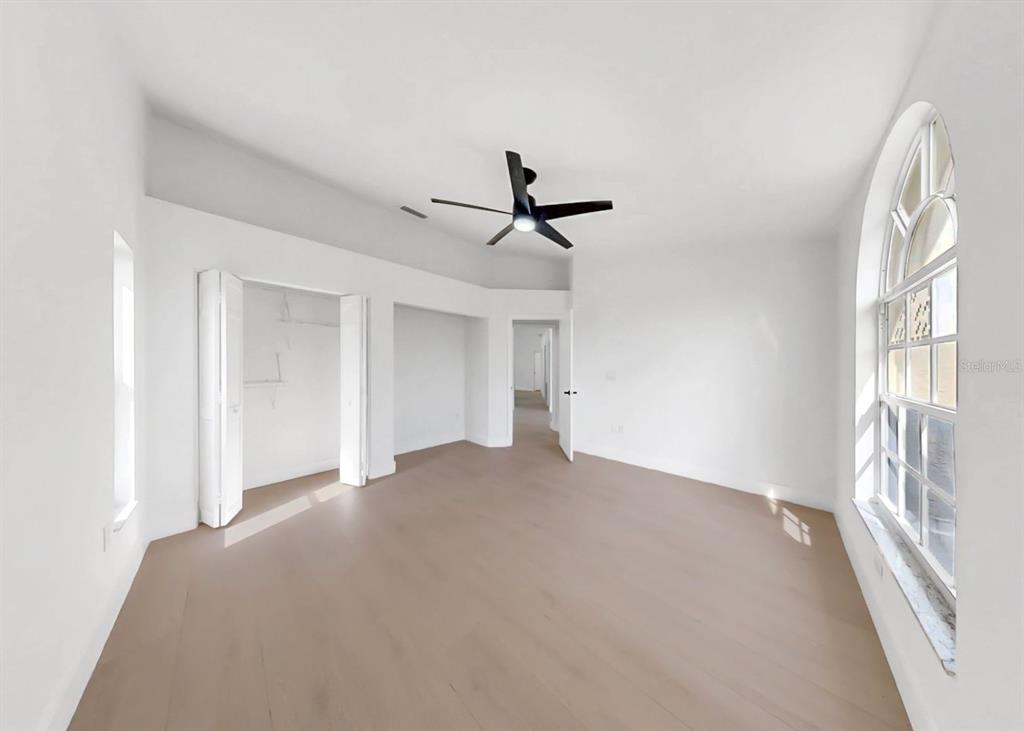 6409 Stone River Road Bradenton, FL 34203 - Photo 54 of 72 a view of an empty room with a window