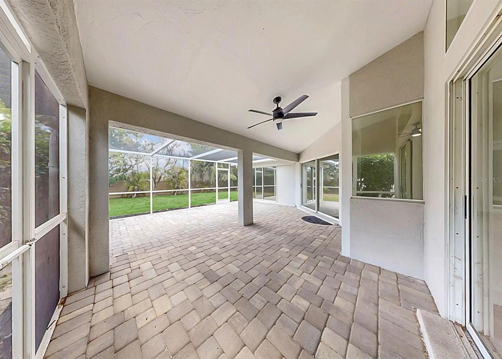 6409 Stone River Road Bradenton, FL 34203 - Photo 65 of 72 a view of an empty room with a window and balcony