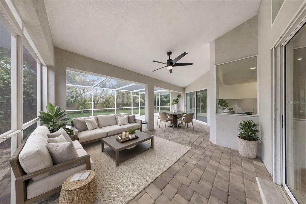 6409 Stone River Road Bradenton, FL 34203 - Photo 66 of 72 a living room with furniture and a large window