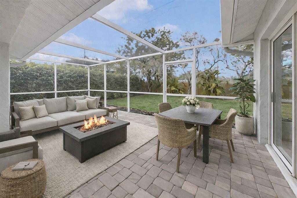 6409 Stone River Road Bradenton, FL 34203 - Photo 68 of 72 a outdoor space with patio the couches and a potted plant on a table