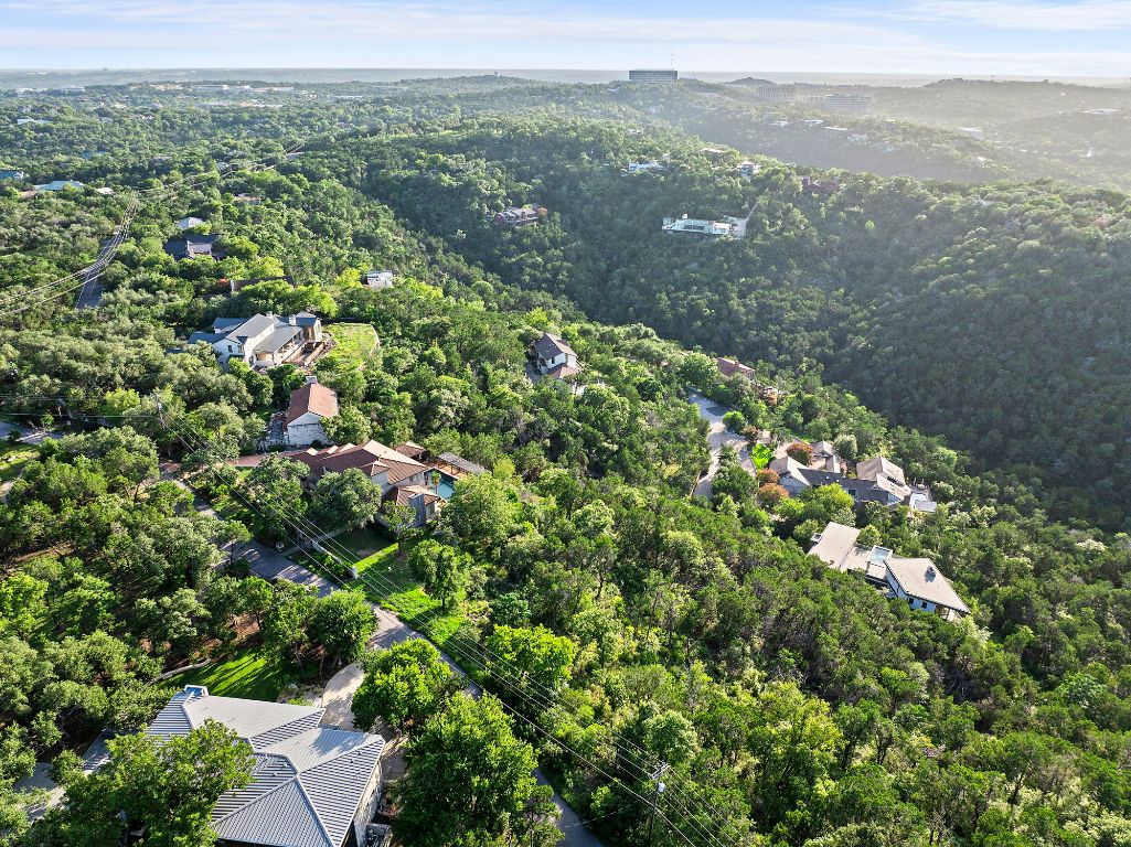 1104 Kennan Road West Lake Hills, TX 78746 - Photo 14 of 20 a view of a city with lush green forest