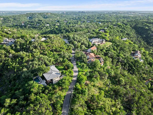 a view of a big yard with lots of green space