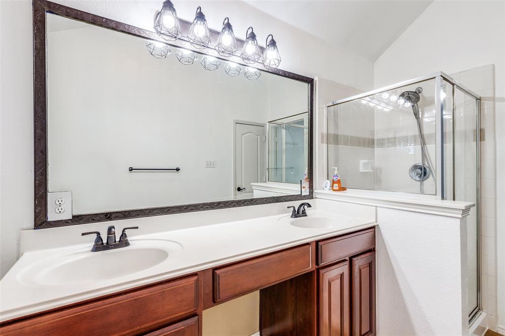11146 Clearstream Lane Frisco, TX 75035 - Photo 18 of 28 a bathroom with a sink and a mirror