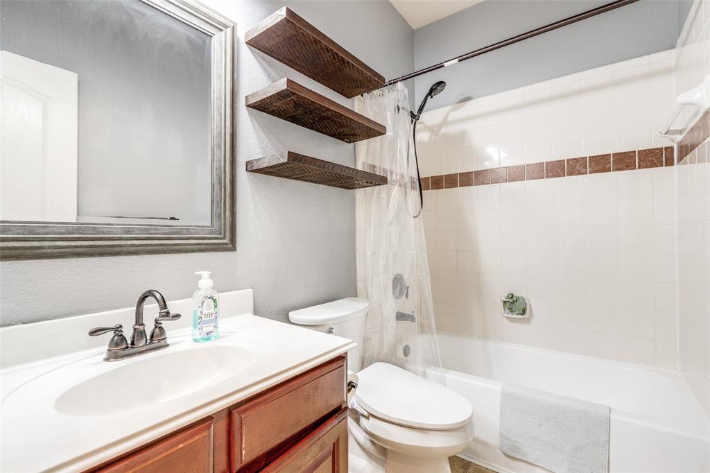 11146 Clearstream Lane Frisco, TX 75035 - Photo 21 of 28 a bathroom with a sink toilet vanity and shower