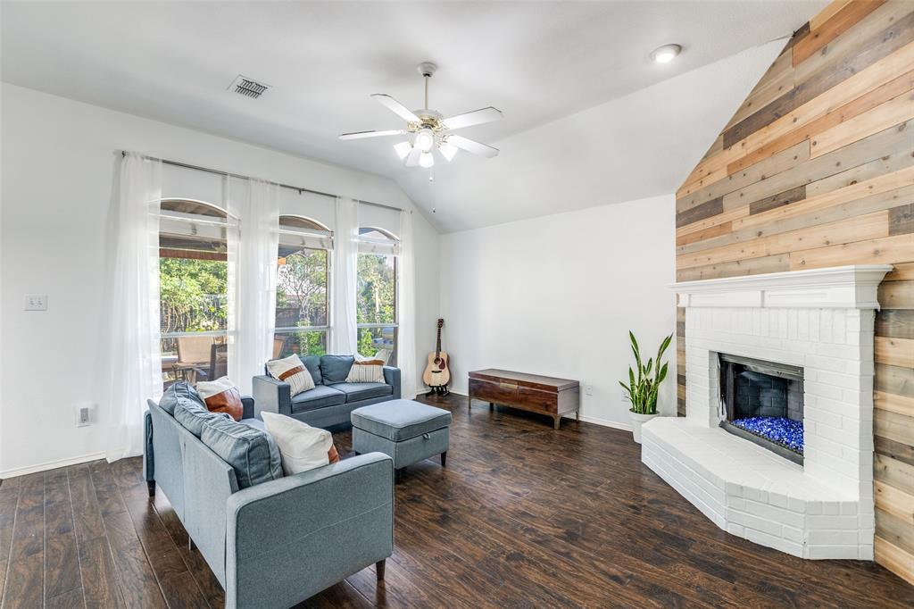 11146 Clearstream Lane Frisco, TX 75035 - Photo 6 of 28 a living room with furniture and a fireplace