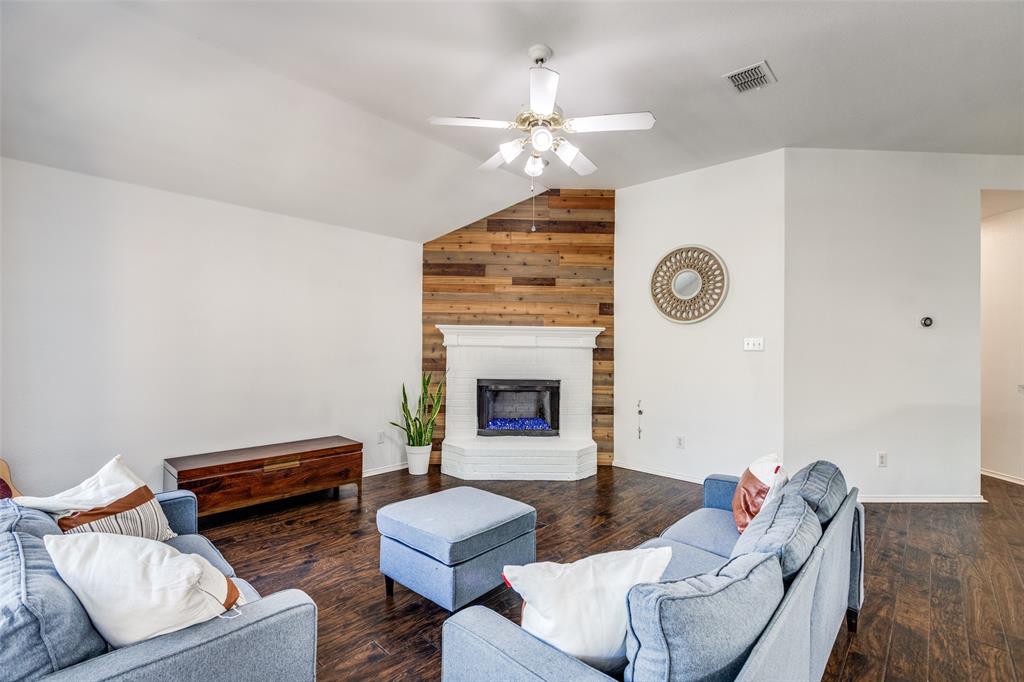 11146 Clearstream Lane Frisco, TX 75035 - Photo 7 of 28 a living room with furniture and a fireplace