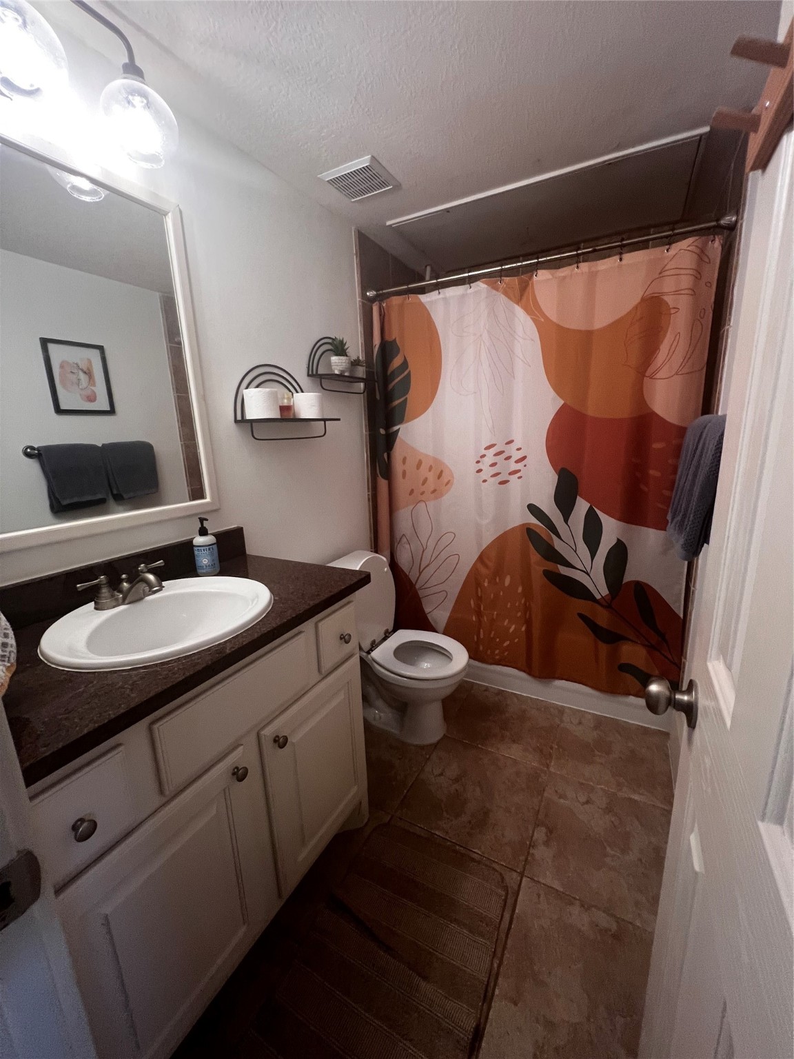 5303 Nett Street, Unit A Houston, TX 77007 - Photo 23 of 23 a bathroom with a sink and mirror