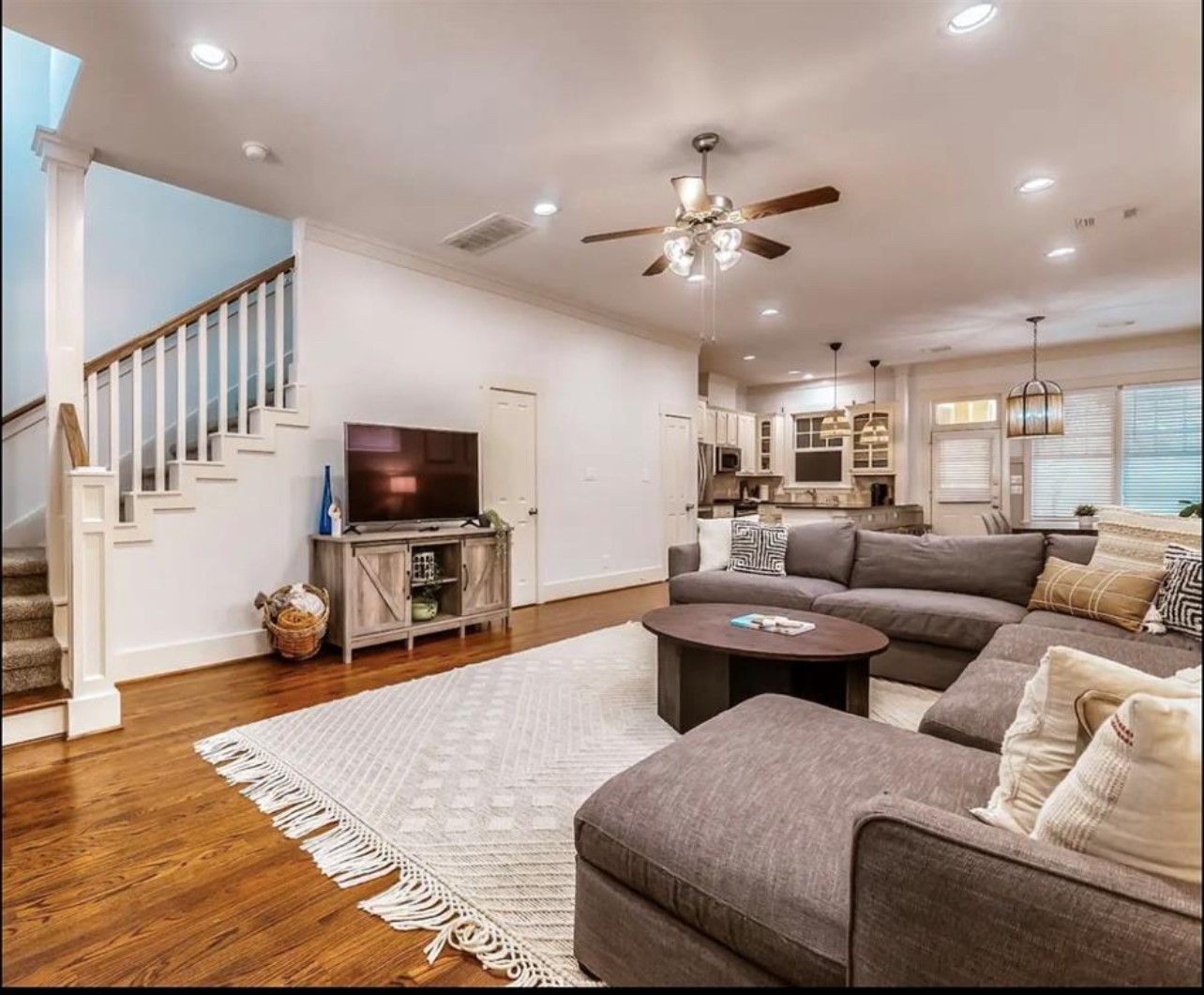 5303 Nett Street, Unit A Houston, TX 77007 - Photo 5 of 23 a living room with furniture and a flat screen tv