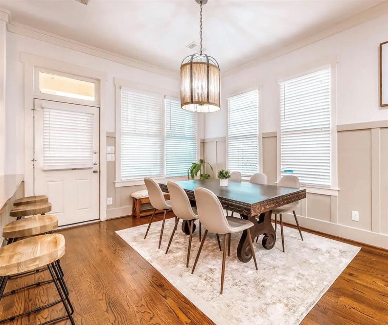 5303 Nett Street, Unit A Houston, TX 77007 - Photo 7 of 23 a view of a dining room with furniture window and wooden floor
