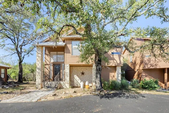 a front view of a house with a outdoor space