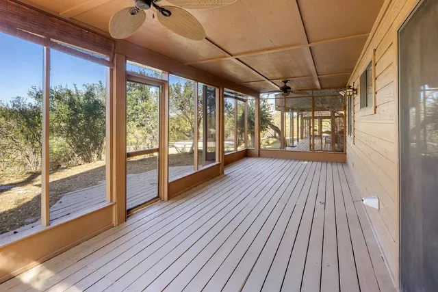 a view of a porch with wooden floor and outdoor space