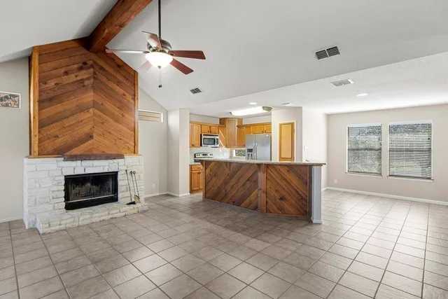 a living room with furniture and a fireplace