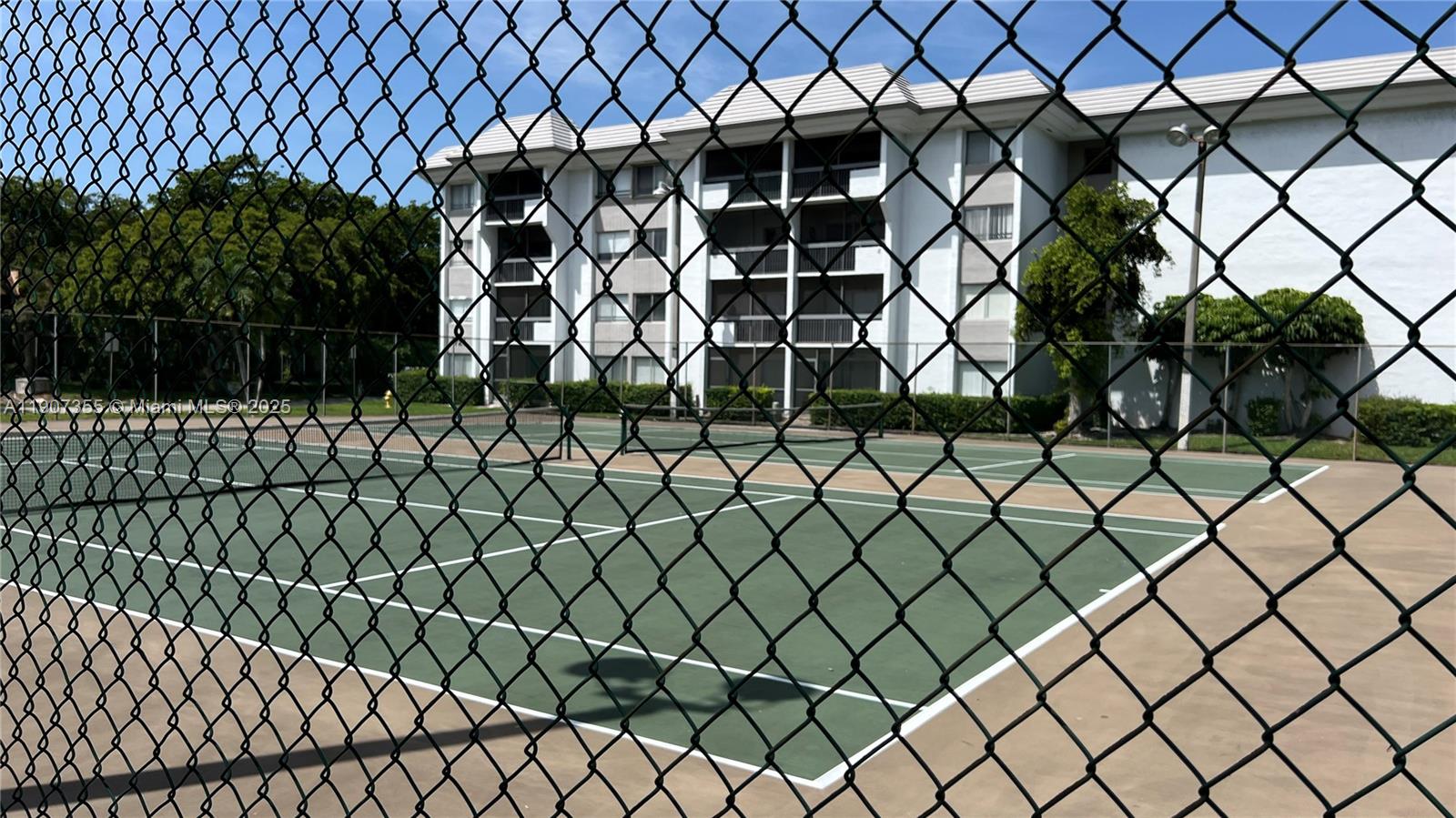 711 North Pine Island Road, Unit 415 Plantation, FL 33324 - Photo 18 of 19 a black and white wall of a black gate