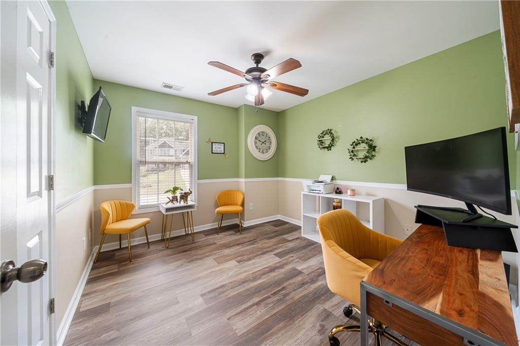 55 Meridian Point Dallas, GA 30132 - Photo 25 of 45 a living room with furniture and a flat screen tv
