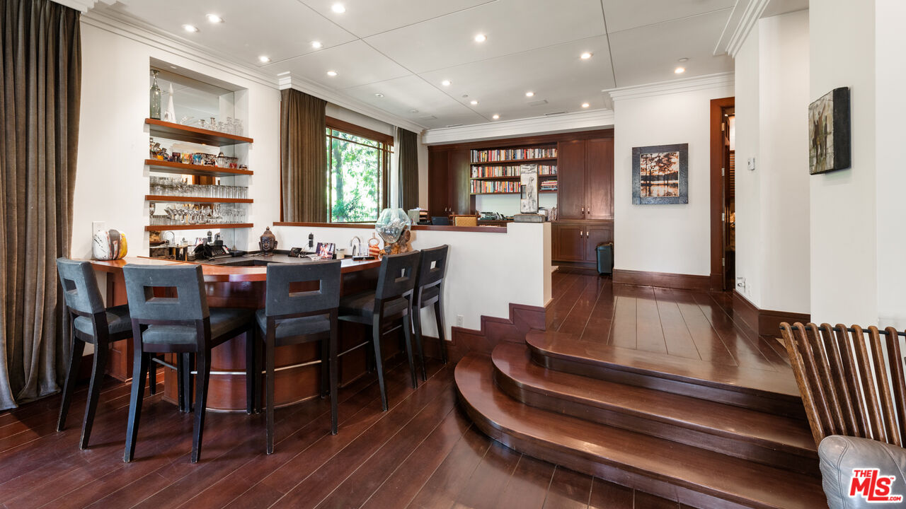 13947 Durham Road Beverly Hills, CA 90210 - Photo 12 of 46 a view of a dining room with furniture window and wooden floor