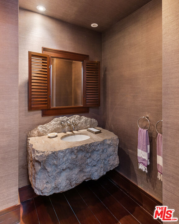 13947 Durham Road Beverly Hills, CA 90210 - Photo 13 of 46 a bedroom with a bed and a night stand