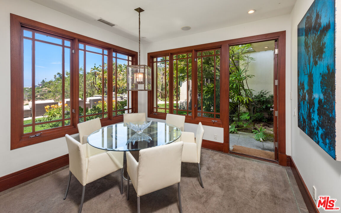 13947 Durham Road Beverly Hills, CA 90210 - Photo 16 of 46 a dining room with furniture window and outside view