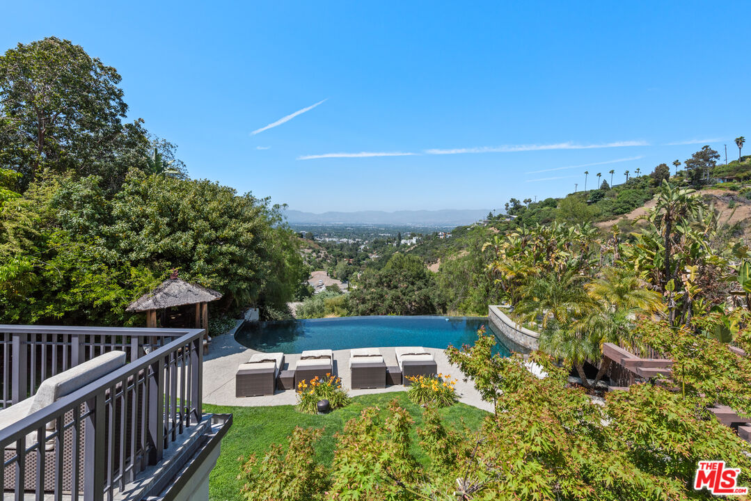 13947 Durham Road Beverly Hills, CA 90210 - Photo 22 of 46 a balcony with an outdoor space