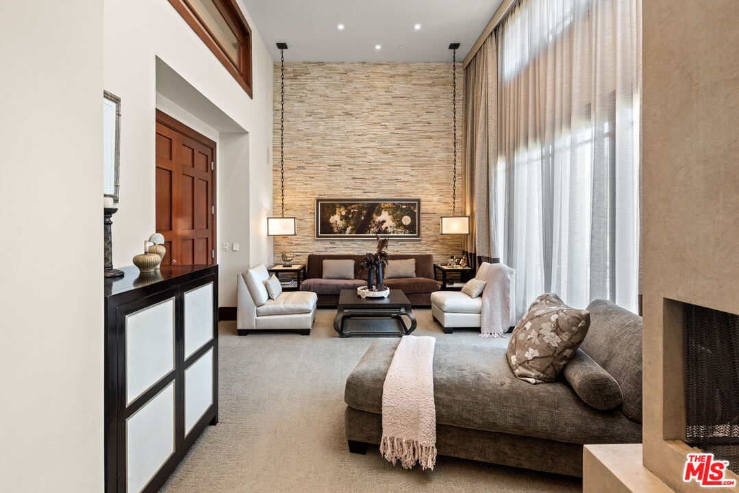 13947 Durham Road Beverly Hills, CA 90210 - Photo 23 of 46 a living room with furniture and a fireplace