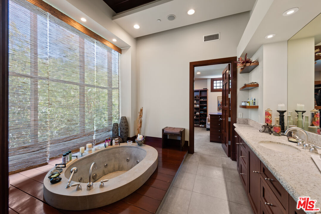 13947 Durham Road Beverly Hills, CA 90210 - Photo 27 of 46 a view of a bathroom with dual sinks